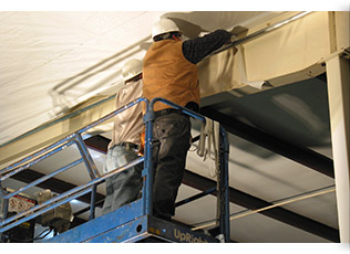 Workers installing Simple Saver System retrofit